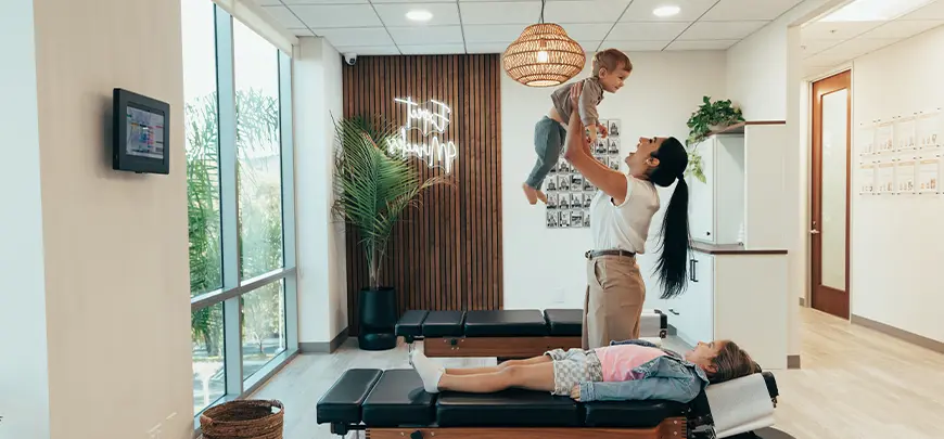 chiropractor discussing spine misalignments with patient