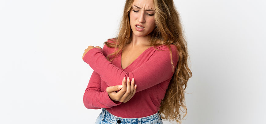 patient needing elbow pain treatment in San Clemente CA